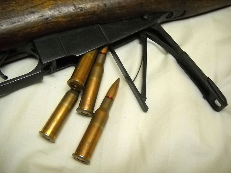 Mosin-Nagant M44 magazine opened, with rounds spilling out